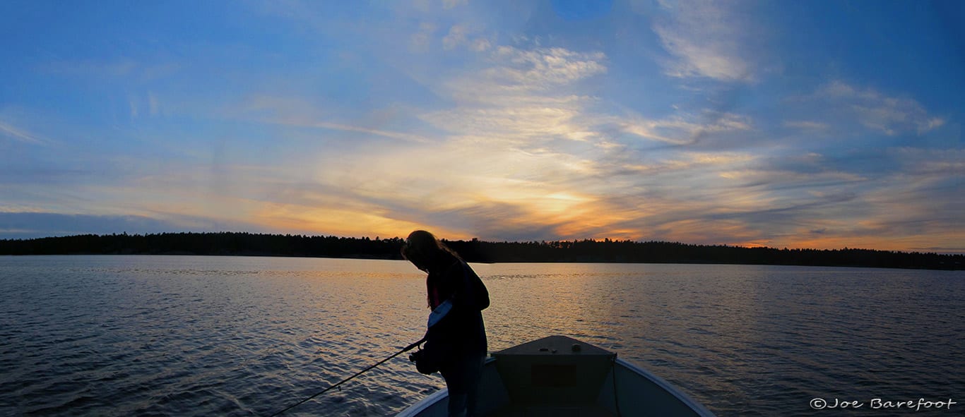 Fishing French River with a sunset and a Female Angler