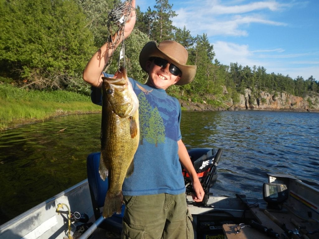 Brandon Lauffer with his 18-inch French River Largemouth Bass