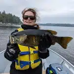 Kim Stilson holding a French River Smallmouth Bass