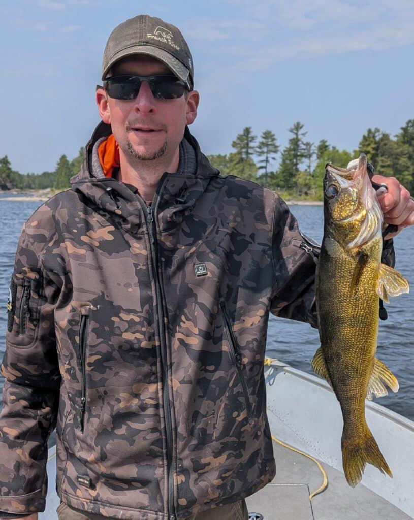 Jim Johnson holding a French River Walleye.