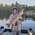 Mike Unruh holding a late May spring French River Walleye.