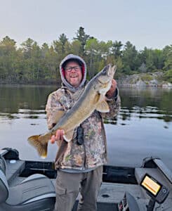 Mike Unruh holding a late May spring French River Walleye.