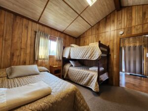 Double and 2 single adult sized bunk beds in the Ryder's Roost French River Cottage.